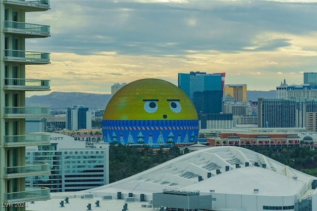 property's view of city featuring a mountain view