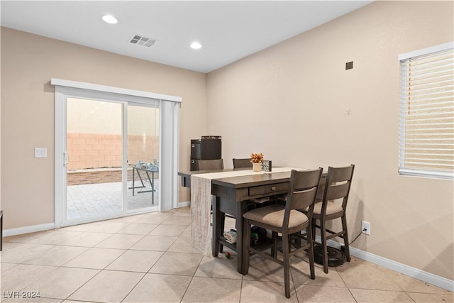 dining area featuring light tile patterned floors