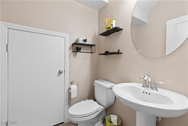 bathroom with toilet and sink