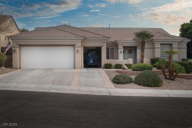 view of front of property with a garage