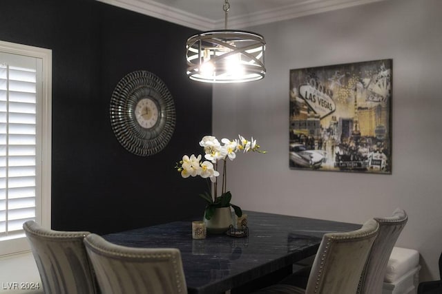 dining space with an inviting chandelier and ornamental molding