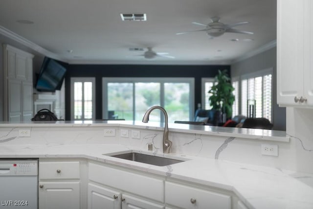 kitchen featuring crown molding, dishwasher, sink, and white cabinets