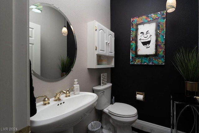 bathroom with sink and toilet