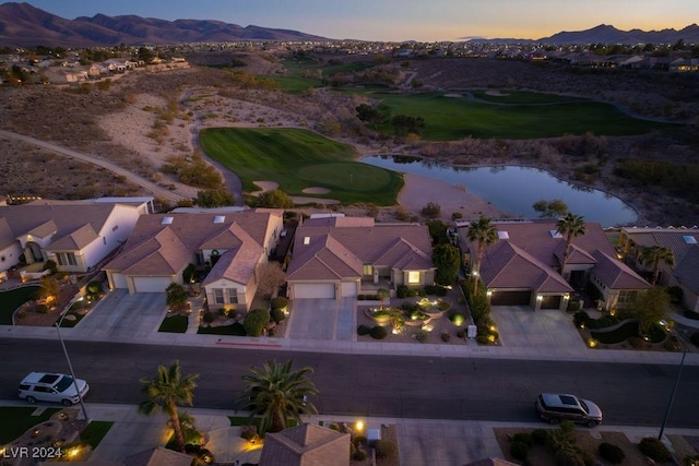 aerial view at dusk with a water and mountain view