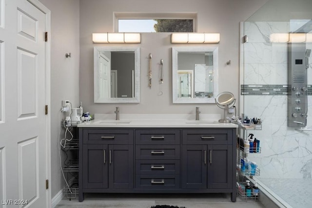 bathroom featuring vanity and tiled shower