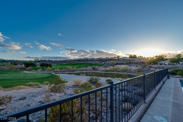 balcony at dusk with a water view