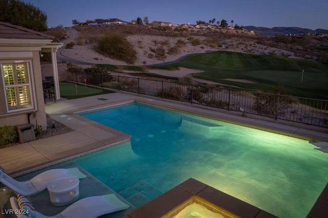 pool at dusk with a mountain view