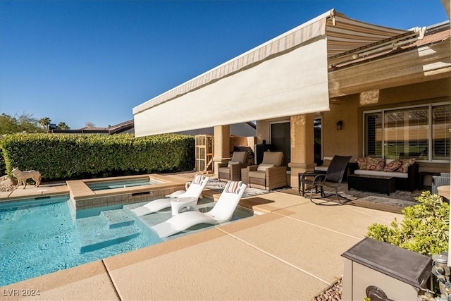 view of pool featuring an in ground hot tub, outdoor lounge area, and a patio area