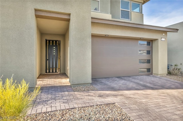 doorway to property featuring a garage