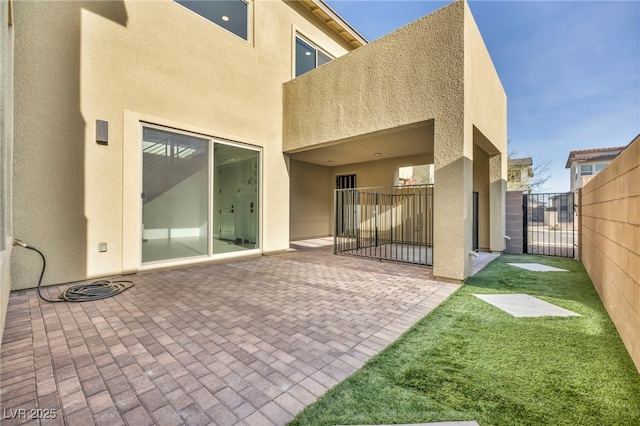 back of property featuring a patio area