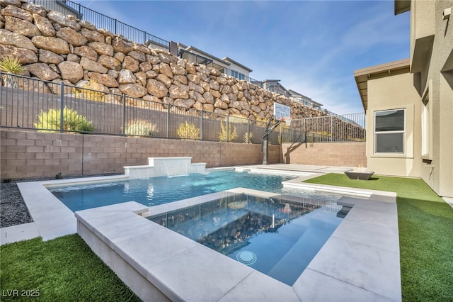 view of swimming pool with an in ground hot tub