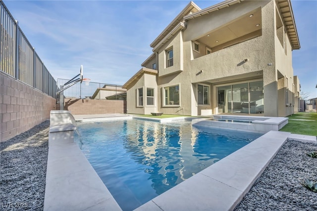 view of pool with an in ground hot tub