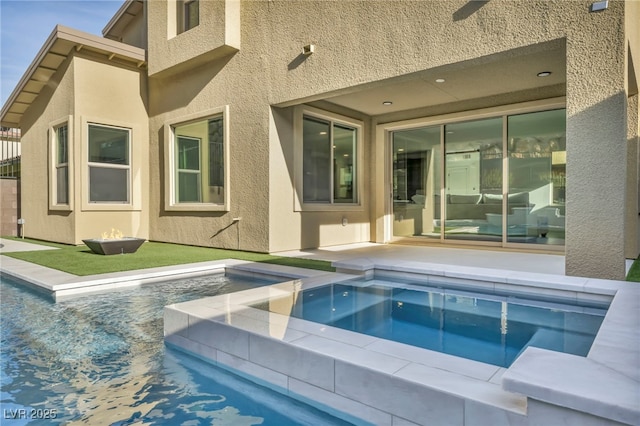 view of pool with a hot tub