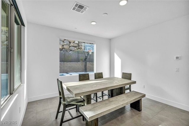 dining area featuring tile patterned flooring