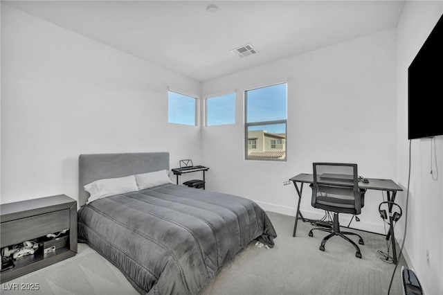 bedroom featuring light colored carpet