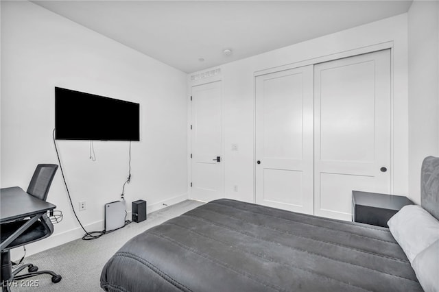 bedroom with carpet floors and a closet