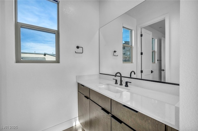 bathroom featuring vanity and a wealth of natural light