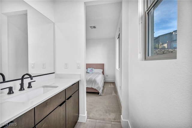 bathroom with vanity and tile patterned floors