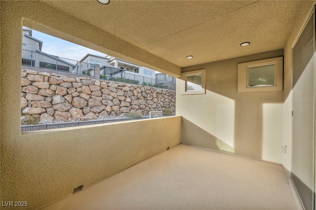 view of patio featuring a balcony