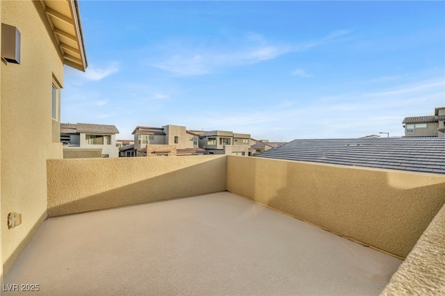 view of patio featuring a balcony