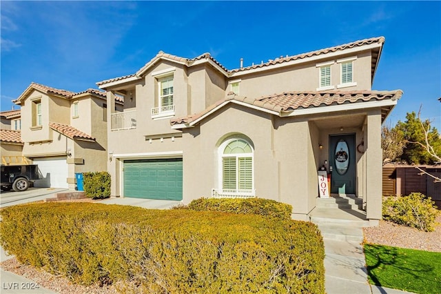 mediterranean / spanish-style house featuring a garage