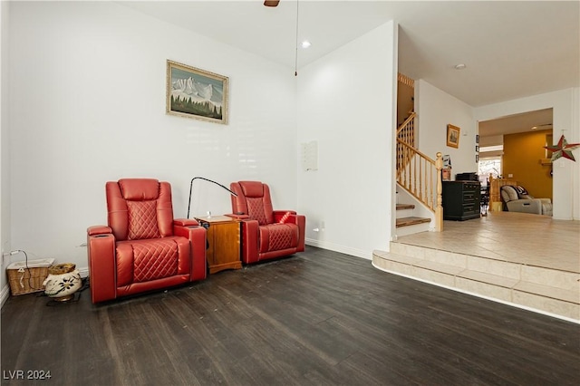 sitting room featuring ceiling fan and dark hardwood / wood-style flooring