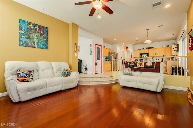 living room with hardwood / wood-style floors and ceiling fan