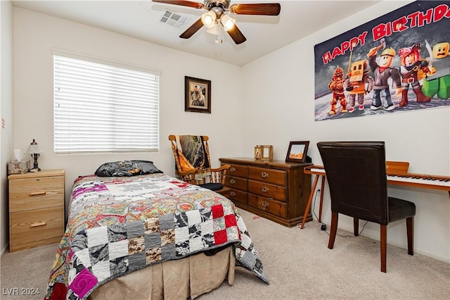 carpeted bedroom featuring ceiling fan