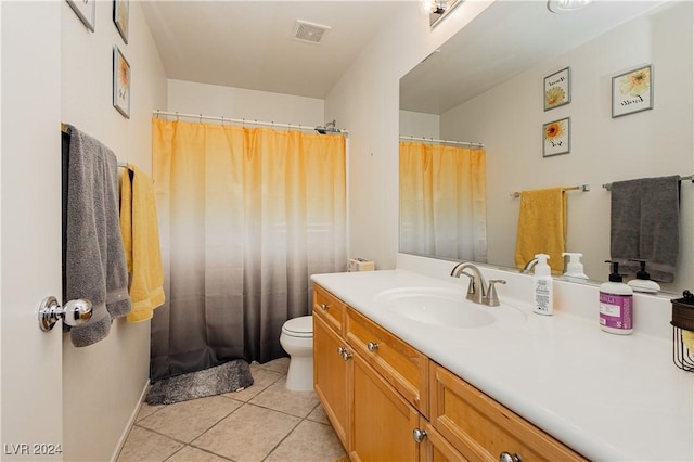 bathroom with tile patterned floors, vanity, and toilet