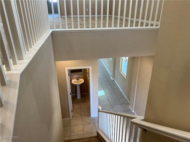 staircase with tile patterned flooring