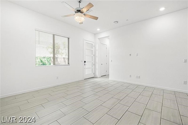 unfurnished room with ceiling fan