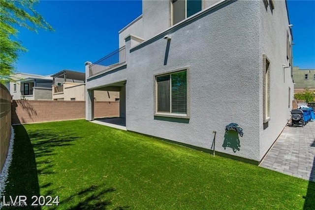 rear view of house featuring a patio