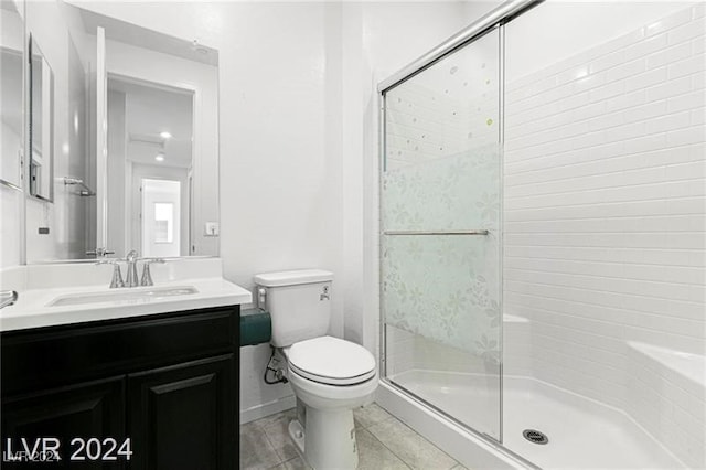 bathroom featuring vanity, toilet, and walk in shower