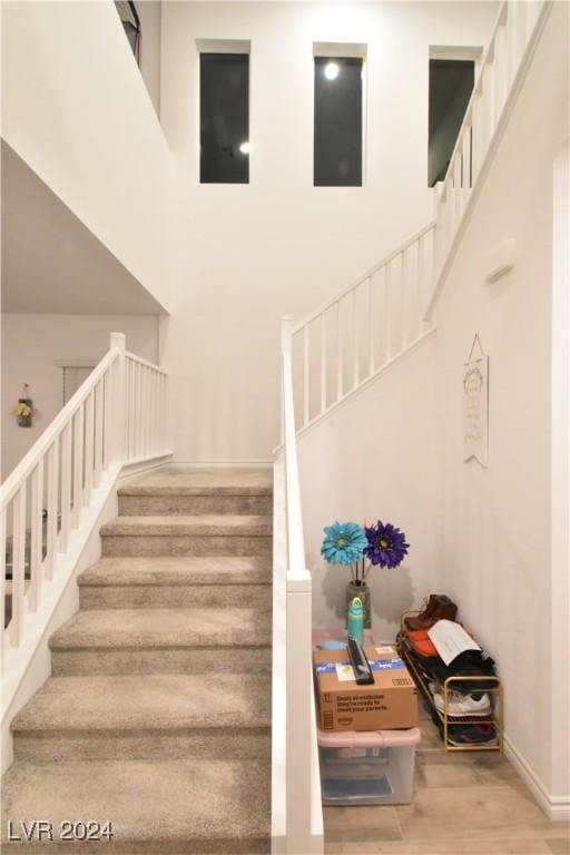 stairway featuring wood-type flooring