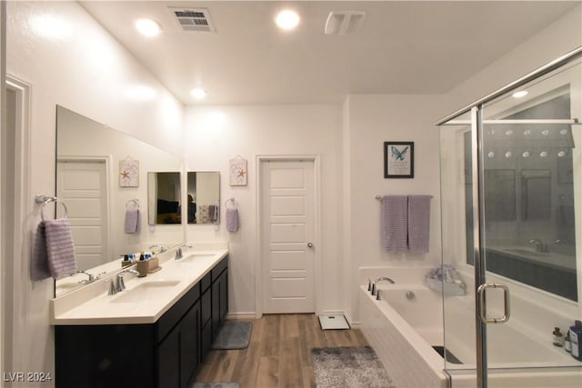 bathroom featuring separate shower and tub, vanity, and hardwood / wood-style flooring