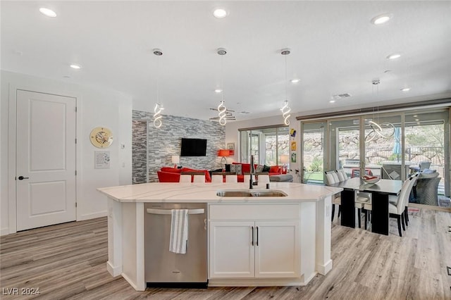 kitchen with white cabinets, pendant lighting, dishwasher, and sink