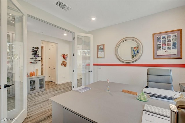 office area with light hardwood / wood-style flooring