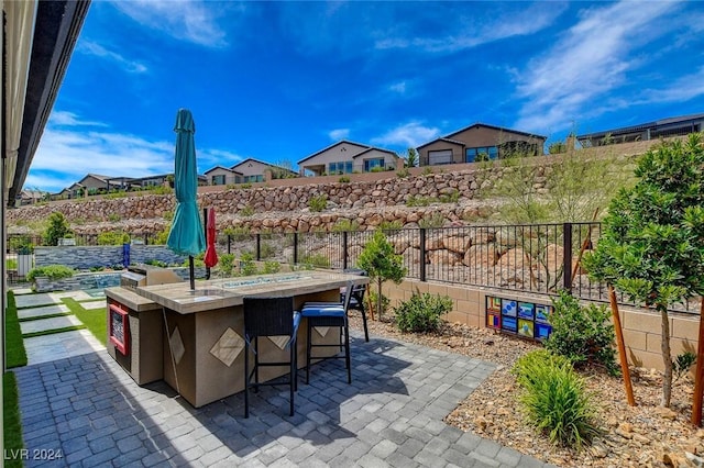 view of patio with exterior bar