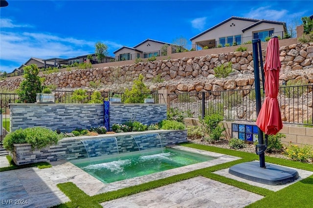 view of home's community featuring a jacuzzi