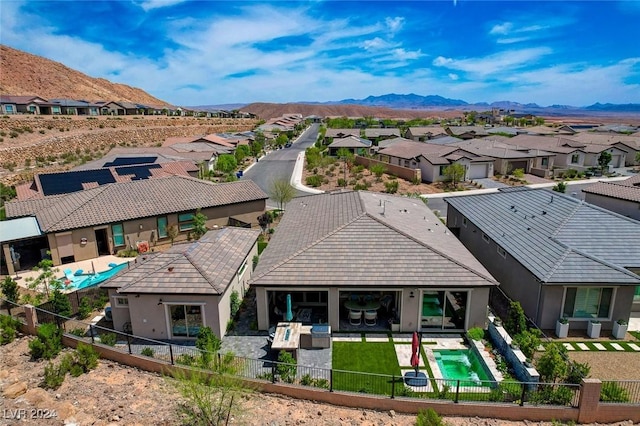 rear view of property with a mountain view and a patio area