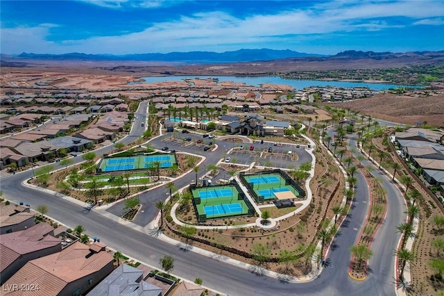 bird's eye view with a water and mountain view