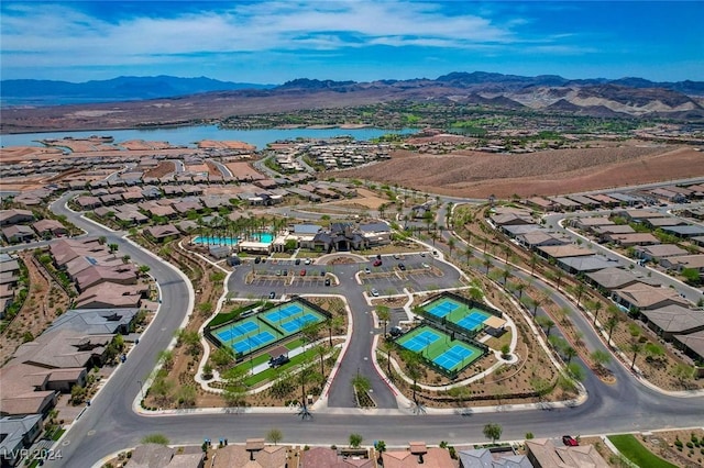 aerial view featuring a water and mountain view