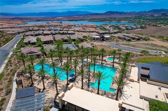 birds eye view of property featuring a water and mountain view