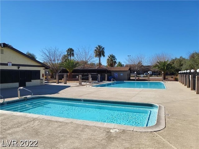 view of pool featuring a patio