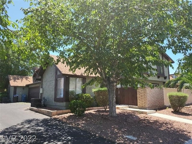 view of property exterior with a garage