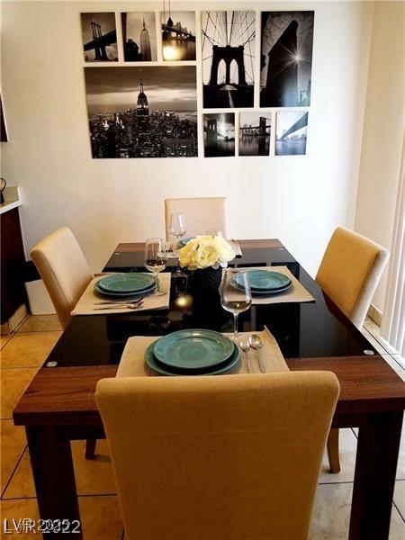 dining space featuring light tile patterned floors