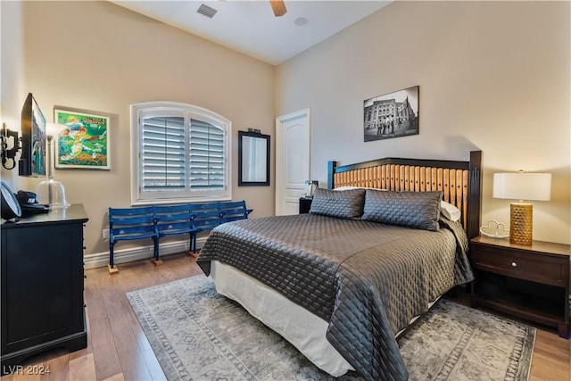 bedroom with ceiling fan and light hardwood / wood-style floors