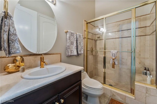 bathroom featuring decorative backsplash, vanity, toilet, and walk in shower