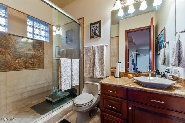 bathroom featuring toilet, vanity, and walk in shower