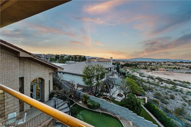 view of balcony at dusk